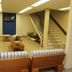 Ilheus North Hotel in Itacaré lobby with striped benches, coffee table, staircase and blue accent wall