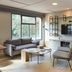 Campanile Nature - Sannois Ermont lounge in Sannois with sofa, chairs, TV, and large window