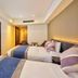 Hotel Mystays Premier Hamamatsucho in Tokyo guest room with two beds and wall-mounted TV