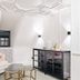 Hotel Riesengebirge in Neuhof an der Zenn: bright lounge with white sculptural sofa and glass tables