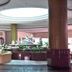 BP Samila Beach Hotel and Resort lobby in Songkhla with seating, plants and a skylit ceiling