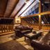 Vitina House in Vytina, loft lounge with leather sofas and wood-beamed vaulted ceiling