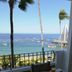 Emperador Vallarta Beachfront Hotel and Suites balcony dining with ocean and boat views in Puerto Vallarta