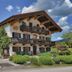 Landhotel Binderhäusl Garni in Inzell, alpine hotel exterior with balconies and garden
