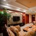 Grand View International Hotel Liaoyang lounge with sofa seating, TV, coffee table and wood display cabinets