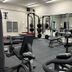 Hotel Killarney fitness center in Killarney with weight machines, dumbbells and mirrored walls