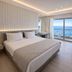 Mediterranean Hotel in Rhodes guest room with sea view, king bed, and balcony seating