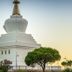 I AM La Posada Hotel and Apartment in Benalmádena, white stupa-like building with tiered roof and trees