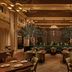 The Vinoy Resort & Golf Club, Autograph Collection in St. Petersburg dining room with chandeliers and plants