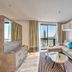 Arjaan by Rotana - Dubai Media City suite with city view, sofa, coffee table and balcony in Dubai