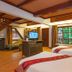 Royal Phawadee Village Patong guest room with twin beds, TV, and large window view