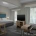 Homewood Suites by Hilton Birmingham-SW-Riverchase-Galleria, Hoover: suite with bed, sofa, TV, and window view
