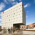 ibis Barcelona Santa Coloma hotel in Santa Coloma de Gramenet, modern white building with glass entrance
