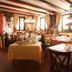 Gasthof zum Löwen in Weißenhorn dining room with set tables and warm wood-beam interior