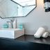 Royal Plaza Hotel Tiberias modern bathroom vanity with vessel sink, wall mirror, sconce and towels