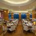 Millennium Hotel Sirih Jakarta in Jakarta restaurant with set dining tables and large windows