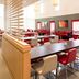 ibis Barcelona Santa Coloma dining area with red seating and tables in Santa Coloma de Gramenet
