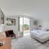 Domaine De La Corniche in Rolleboise, airy guest room with king bed and balcony door