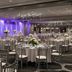 Cleveland Marriott East ballroom in Warrensville Heights with round banquet tables, chandeliers and purple uplighting