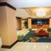 Fairfield Inn & Suites by Marriott Seattle Bremerton lobby with seating area and colorful rug in Bremerton