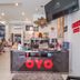 OYO 1134 Baan Zarn Guesthouse reception desk in Patong with TV and seating area