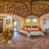 Hakka Park International Hotel in Meizhou room with twin beds and curved wooden ceiling