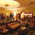 Diamonds Malindi lounge with patterned sofas, arched windows and warm ceiling lighting in Malindi
