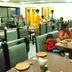 Hotel Bhagyalaxmi in Shirdi dining area with guests seated at tables and staff serving