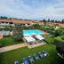 Hotel Porto Azzurro in Sirmione with outdoor pool, sun loungers, and landscaped garden