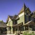 Swantown Inn & Spa in Olympia, Victorian-style inn exterior with porch and purple flowers