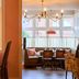 The White Horse in Dorking dining area with chandelier, large windows and window-side seating