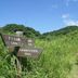 Yugawara Bay Mandarin House in Yugawara with a grassy hillside trail and wooden signpost