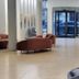 Hotel Három Gúnár lobby in Kecskemét with seating, reception desk and glass entrance doors