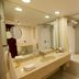 The White Hotel Katra bathroom with double vanity, large mirror and bathtub, Katra