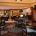 Staybridge Suites Sioux Falls At Empire Mall lobby lounge with fireplace and seating area