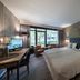 Bilderberg Hotel 't Speulderbos room in Garderen with king bed, desk, chair, and forest-view windows