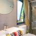 Concept Village Piccola Gardiola bathroom with walk-in shower, sink, window and towel in San Felice del Benaco