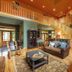 Copper Creek Inn, Cabins and Lodge in Ashford: spacious lodge lounge with staircase, leather seating and loft