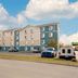 Extended Stay America Select Suites - Panama City - Callaway exterior with parking lot and cloudy sky