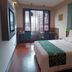 South Garden Hotel Chongqing guest room with double bed, desk by window and wood flooring