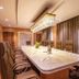 Hotel Himalaya Kathmandu meeting room with long conference table, high-back chairs and chandelier lighting