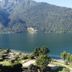 Park Hotel Abbadia in Abbadia Lariana with lakefront view of calm water and wooded mountains