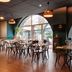 ibis Paris Tour Eiffel Cambronne 15ème dining room with arched windows and café tables