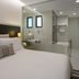 Fraser Suites Singapore bedroom with en suite bathroom and modern vanity in Singapore