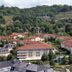 City Hotel Dresden Radebeul in Radebeul with red-roofed buildings and green hillside backdrop