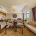 Jingland Exhibition Hotel in Xishuangbanna lounge with beige seating and large window