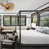 Gaige House in Glen Ellen guest room with four-poster bed, fireplace, and large forest-view windows