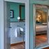 Hotel du Vin Brighton bathroom and bedroom mirror view with tiled shower area and wood floors