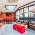 Ashbys Accommodation & Spa hire in Portsmouth lounge bar with seating, high stools, and skylight