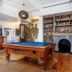 The Shakespeare Hotel Auckland lobby with pool table, fireplace and bookshelves